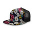 A flat peak mesh cap featuring a floral pattern with white and pink daisies on a dark background and a black mesh back.