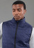 A navy lightweight packable insulated puffer vest on a model, featuring a high collar and zip closure.