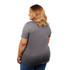 A woman is wearing a grey polo shirt, showing the back view. The shirt has short sleeves and a fitted design.