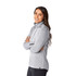 A light grey women's half-zip jumper featuring a high collar and a branding logo.