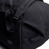 A black duffel bag featuring adjustable straps and a sleek design, with a logo on the side.