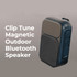 A black and grey Bluetooth speaker with a magnetic back and control buttons, featuring a mesh speaker grille.