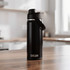 A drink bottle in matte black with a lid and carrying handle, featuring a logo. Suitable for travel and outdoor activities.