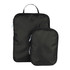 A set of black compression packing cubes in two sizes with zippers and handles. Features a logo.