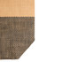 A large tote bag featuring a woven design in beige and black, with a textured surface and a logo.