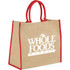 A large jute tote bag in beige with red handles and trim, featuring a logo on the front.