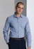 A classic fit long sleeve shirt in blue stripe, featuring a collar and button-up front. The model has a shaved head.