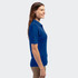 A blue polo shirt for women, featuring a collar and short sleeves, displayed on a model from the side.