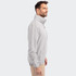 A men's full zip jacket in light grey, featuring a high collar and side pockets, displayed on a model.
