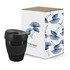A drink bottle in black, accompanied by a decorative box featuring floral designs.