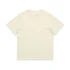 A plain cream-coloured T-shirt with short sleeves and a crew neck. It features a logo on the inside label.