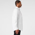 A white button-up Oxford shirt displayed on a model in a side profile view, featuring a collar and long sleeves.