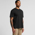 A black t-shirt featuring a classic design and a logo, worn by a man with tattoos, standing against a plain background.