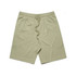 Light green sports shorts with an elastic waistband and drawstring, featuring a logo.