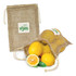 A jute net produce bag in natural colour, filled with lemons, alongside a lemon half and leaf. The bag has a logo.