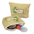 A tan cosmetic bag with floral design, partially open to reveal various beauty products inside.