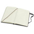 A large Moleskine Pro hard cover notebook with blank lined pages and a black cover. It includes a ribbon bookmark.