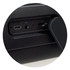 A close-up of a black Bluetooth speaker showcasing USB-C, AUX, and TF card ports. The speaker features a textured surface.