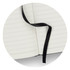 A black Petros Stone Paper Notebook with blank, lined pages and a black ribbon bookmark.