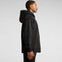 A black hoodie with a half zip and a front pocket, featuring a hood and a branding logo.