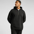 A black hooded jumper featuring a half zip, front pocket, and a relaxed fit. Includes a logo on the garment.