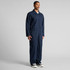Navy canvas coveralls with long sleeves and zip front, featuring a logo on the chest. Suitable for workwear.