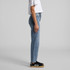 Straight leg jeans in light blue, showcased on a model wearing a white cropped t-shirt and black shoes.