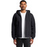 A black canvas bomber hood jacket featuring a front zipper and drawstring hood, worn by a model.