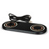 A sleek black dual wireless charger with gold accents and a USB cable. It features a modern design and branding.