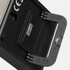 A black kitchen timer with a stand, featuring a metallic back and a small flip cover. It has a logo on the side.