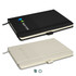 A black and cream notebook featuring a logo on the cover, with a stylish design and elastic closure.
