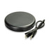 A compact black charging pad with a USB cable. The design is sleek and round.