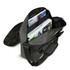 A grey satchel bag with an adjustable strap, featuring open compartments filled with magazines and documents.
