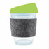 A reusable coffee cup featuring a clear design, a green silicone lid, and a gray felt band for grip.