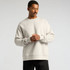 A light grey jumper sweater with a relaxed fit, featuring long sleeves and a crew neck. It has a subtle logo.