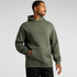 A man wearing an olive green hoodie featuring a front pocket and a hood, with a logo on the sleeve.