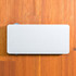 A power bank designed for wireless charging, featuring a sleek and minimalist white exterior.