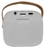 A compact white boombox mini speaker with a brown strap and various ports on the back.