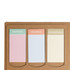 A planner with three colored tabs for Monday, Tuesday, and Wednesday, set against a brown kraft background.