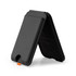 A black phone wallet with a stand feature, designed to hold a phone and cards. It has a small orange detail.