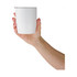 A white coffee cup held in a hand, featuring a simple design and a clear lid. It has a logo visible on the front.