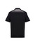 A black short sleeve polo shirt featuring a patterned back and contrasting white details. Includes a logo.