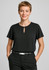 A black short sleeve blouse featuring a keyhole detail at the neckline, accompanied by a person wearing tailored trousers.