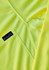 A close-up of a men's long sleeve polo in bright yellow, featuring a logo on the fabric.