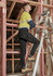 Men's lightweight outdoor cargo pants in black worn by a person on a ladder, set in a construction environment.