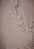 Close-up of a pair of men's cargo pants in a light beige colour, featuring a side pocket. The pants have a textured fabric.