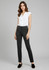 A model wearing women's black slacks, styled with a white shirt and black slip-on shoes. The image features a brand logo.