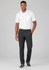 A man wearing black flat front slacks paired with a white short-sleeve shirt and grey sneakers. There is a logo on the slacks.