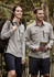 A light grey long sleeve button-up shirt is worn by a man and a woman outdoors, with a backpack and shorts.