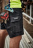 Black men's cargo shorts with multiple pockets, featuring a logo, ideal for work environments.